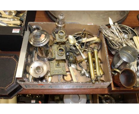 A box of miscellaneous metalware, to include pair of brass candlesticks, loose flatware, silver plated lighthouse sugar sifte