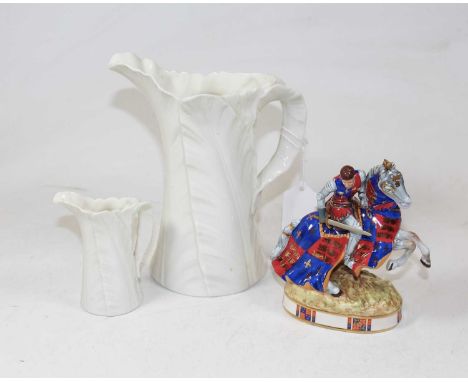 A circa 1900 Royal Worcester leaf moulded jug, having a green printed mark verso, h.18cm; together with another smaller examp