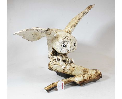 A large William Lawrence ceramic model of an owl, having outstretched wings and perched on a branch, signed verso and numbere