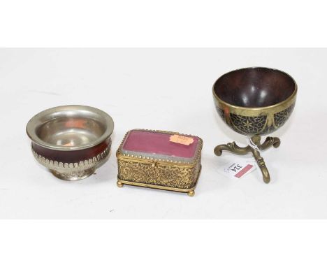 A French trinket box and cover having glazed lid, the brass body with foliate engraved decoration, on ball feet, together wit