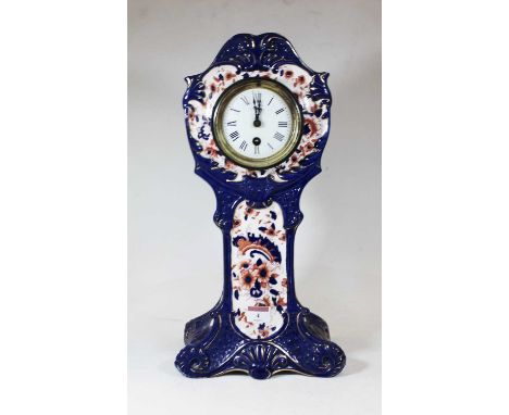 An early 20th century S Fielding &amp; Co porcelain cased mantel clock, decorated in shades of cobalt blue and iron red, havi