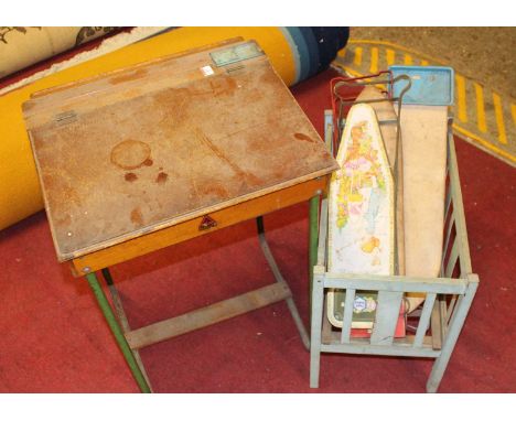 A 1950s lift top children's desk  together with various Chad Valley and Triang ironing boards and a dolls wooden cot