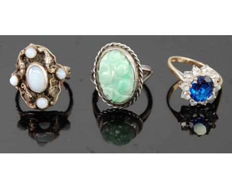 A 9ct gold, blue and white stone set cluster ring, size O; together with a silver and carved celadon jade set ring; and a whi