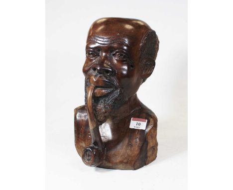 A large carved hardwood head and shoulders portrait bust of a man smoking a pipe, h.27cm