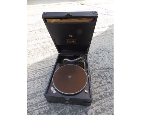 An HMV wind-up portable record player.