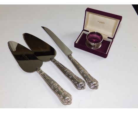 A silver-handled King's pattern cake knife, two matching pie servers and an engine turned napkin ring. (4)