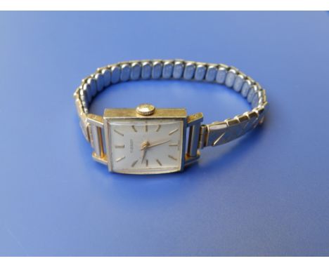 A lady's gold plated Tissot bracelet wrist watch with rectangular dial.