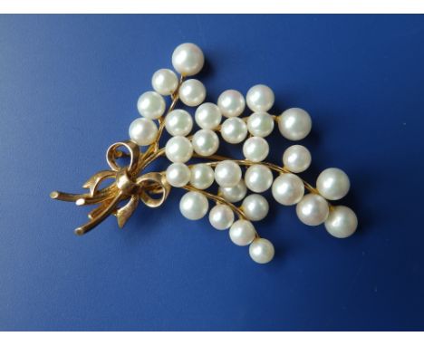 A pearl set 9ct spray brooch.