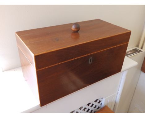 A late Georgian mahogany tea caddy.