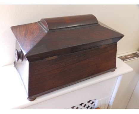 An early Victorian rosewood sarcophagus tea caddy.