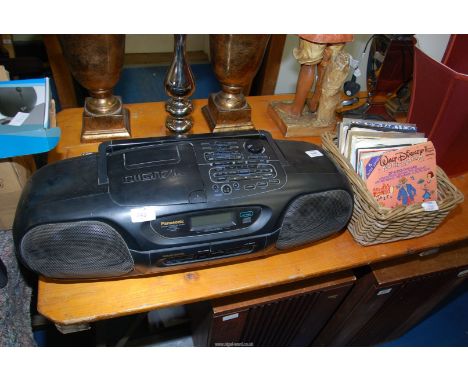 A Panasonic tape and CD player and a box of singles, The Boomtown Rats,The Carpenters, The Eagles etc.
