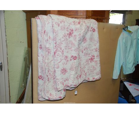 A floral quilt/throw.