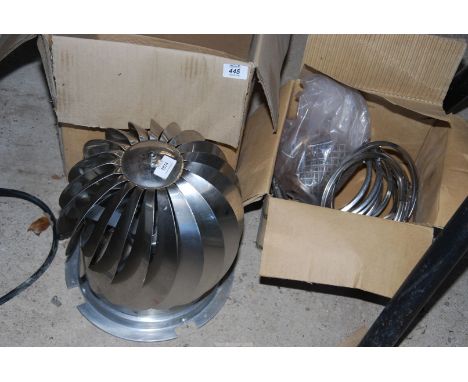 An aluminium chimney cowl and flue pipe fixings.