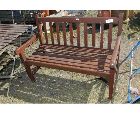 A wooden garden bench, 4ft x 19'' deep x 32'' high.