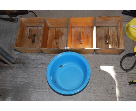 Four wooden trugs and an enamel bowl.