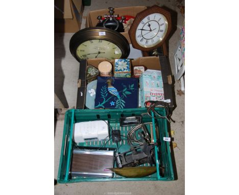 Three boxes of biscuit tins, clocks, spurs, scales etc.
