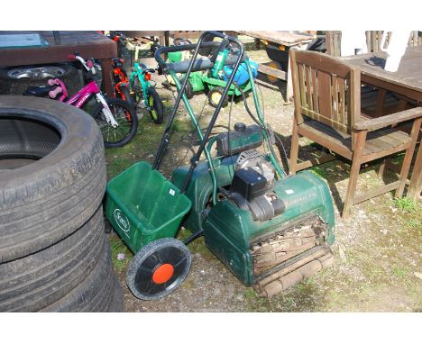 A "Scott's" lawn spreader and an "Atco Balmoral 17 SE" mower, Good Compression.