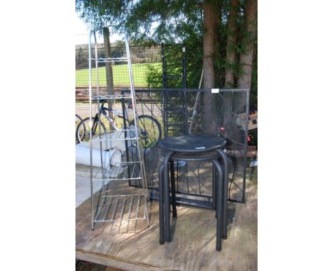 A pot stand, two stools and a fireguard.