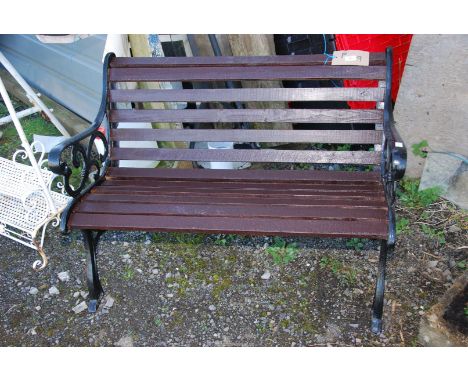 A slatted garden bench with cast iron ends, 44" wide x 29" high x 19" deep.