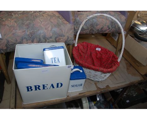 Enamel storage bins and a basket.