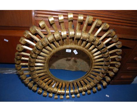 An ornate circular wall mirror by "Graham & Green" approx 3 ft diameter.