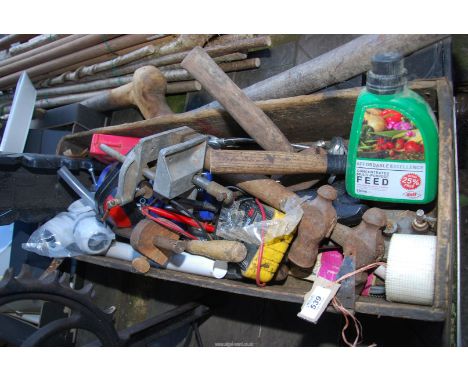 A wooden tray of tools, hammers, etc.
