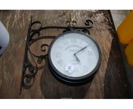 A double sided garden/outdoor clock on a wrought Iron bracket.