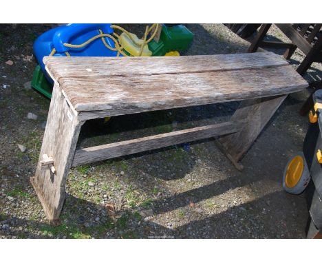 A wooden bench, 49" long  x 11" wide x 26" high.