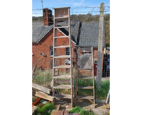 Two wooden step ladders.