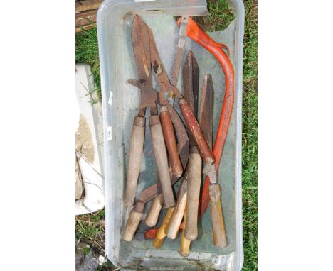 A box of garden shears, bow saw, etc.