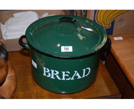 An enamel bread bin 12" diameter x 8" high.