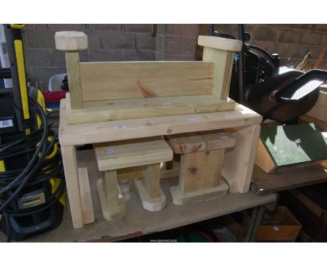 A Child's pine table, stools and bench.