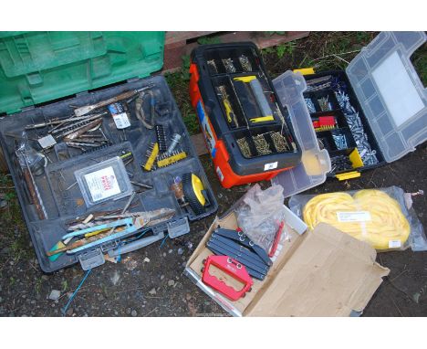 Tool boxes of screws, drill bits, a sling and a riveter.