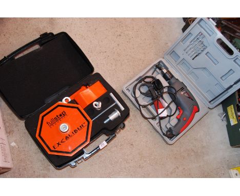 A hammer drill and a wheel clamp.