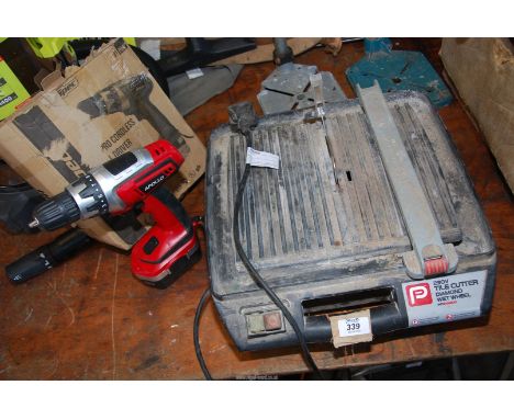 A tile cutter and a cordless drill.