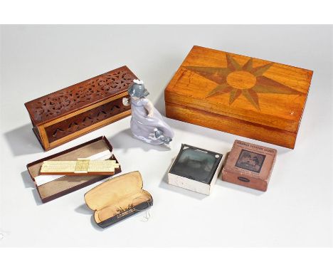 Mixed works of art, to include boxes, a rule, slides, Nao figure and a cased pair of spectacles 