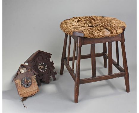 Stained wood stool together with a cuckoo clock