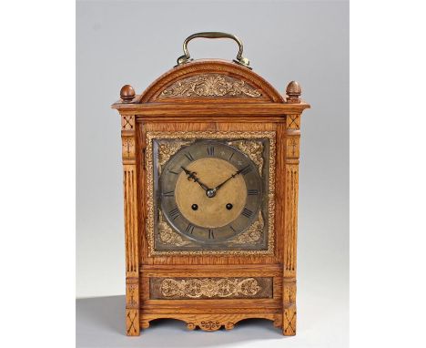 Late 19th Century oak cased bracket clock, the domed top over a rectangular body with fluted pilasters and aesthetic style mo