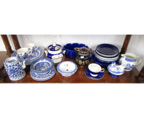 Shelf of china to include Willow pattern