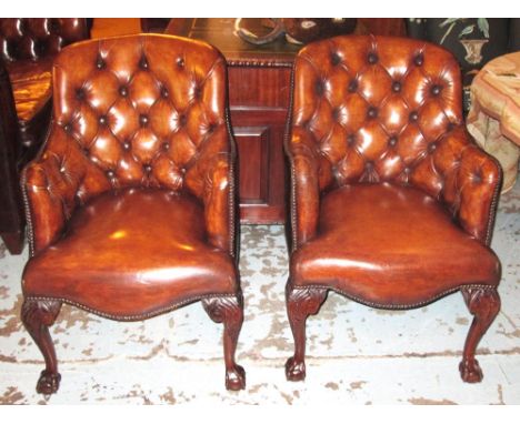 TUB ARMCHAIRS, a pair, early 18th century style walnut with shaped deep button upholstered back in faded tan brown leather wi