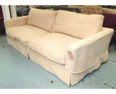 SOFA, of large proportions with loose cream covers, 250cm L. 