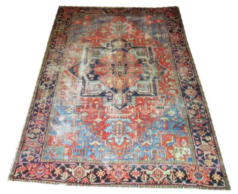 ANTIQUE SERAPI CARPET, 325cm x 233cm, circa 1880, pendant medallion with geometric palmettes and vines on a rouge field withi