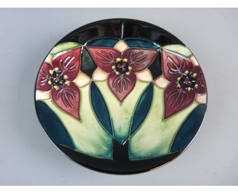A BOXED MOORCROFT MODERN PATTERN PIN DISH, 11.5 cms diameter, impressed factory marks with written 'K W and W M', dated 2000