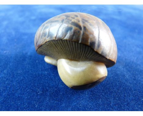 AN ORIENTAL NETSUKE in the form of a mushroom, signed
