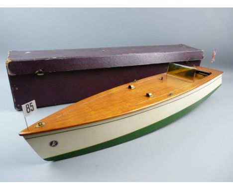 A KELLMER BATTERY OPERATED MOTOR LAUNCH, a German made wooden model in cream and green hull livery with windscreen and flags 