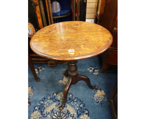 AN ANTIQUE OAK TILT TOP TRIPOD TABLE, the 59 cms diameter top on a carved column with shaped legs and knurled feet, (repair t