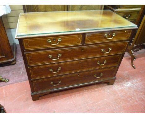 AN INLAID MAHOGANY CHEST of two short over three long drawers, pine lined with cock beaded edges and brass swan neck handles 