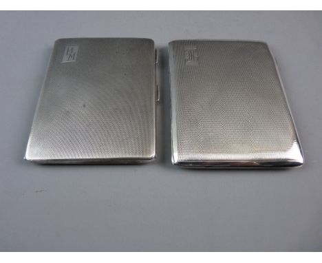 TWO HALLMARKED SILVER CIGARETTE CASES with engine turned decoration, Birmingham hallmarks for 1939 and 1942, 8.8 troy ozs gro