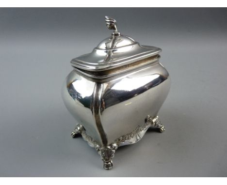 A CHESTER HALLMARKED SILVER TEA CADDY of bombe form, the lid with flame finial, chased lower decoration on paw feet, Chester 