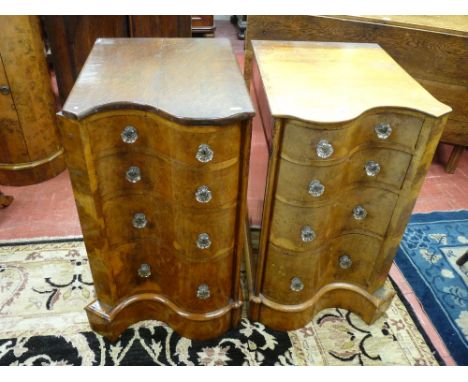 A PAIR OF OAK AND WALNUT SERPENTINE FRONT BEDSIDE CHESTS of four drawers with glass knobs, 73.5 cms high, 43.5 cms wide, 58.5
